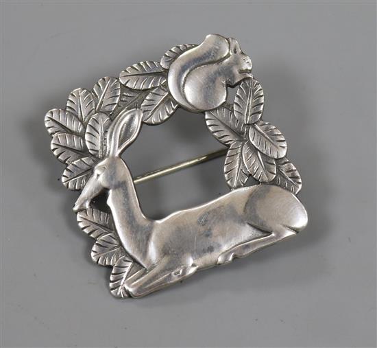 A Danish Georg Jensen sterling silver square recumbent deer brooch, no. 318, 38mm.